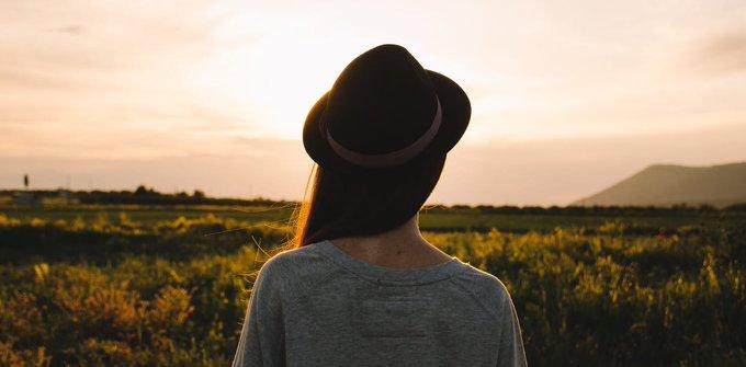 Silhouette of a woman in a field.