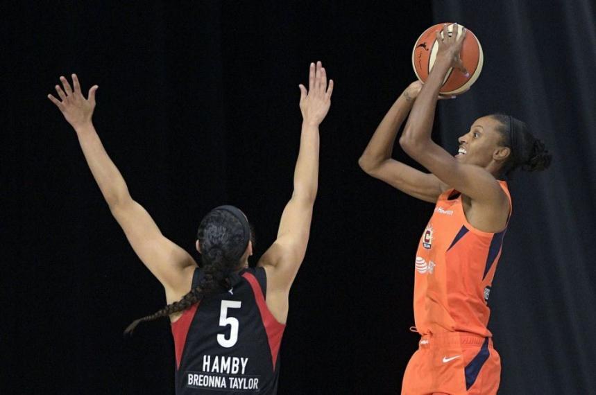 Women playing basketball