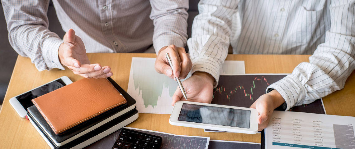 Two people looking at stocks