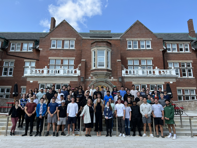 Connie Zavitz with a group of Commerce students in Lang Plaza