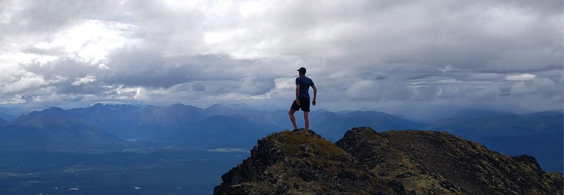 Nathan standing on mountains