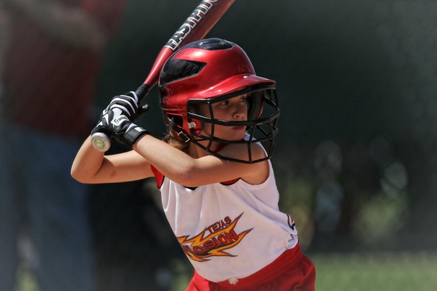 girl playing softball