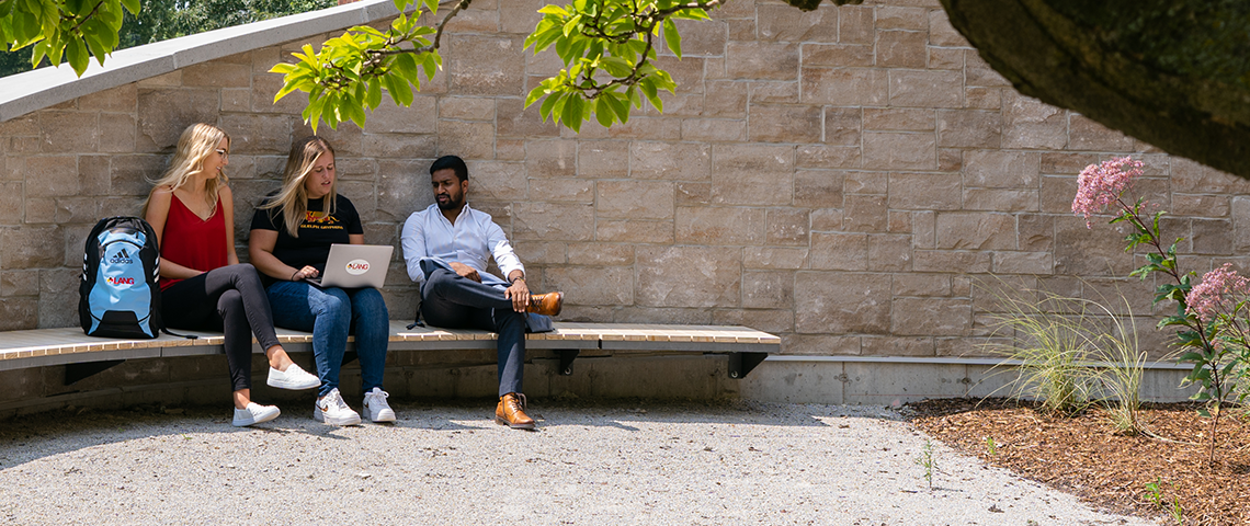 students outside on campus talking