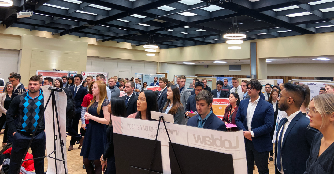 Students listening to industry speakers address the crowd