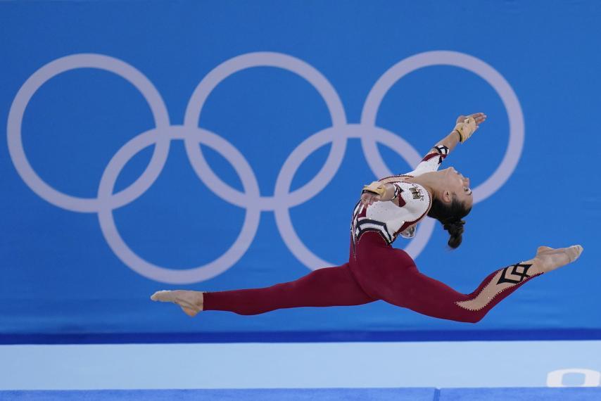 Female gymnast in the air at the Tokyo 2020 Olympic Games