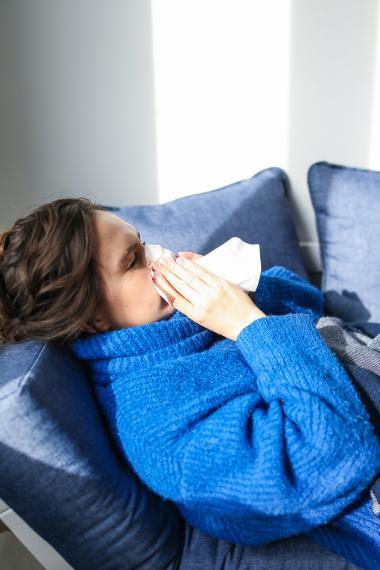 woman sick in bed