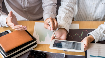 Two people looking at stocks