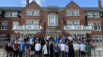 Connie Zavitz with a group of Commerce students in Lang Plaza