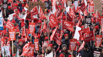 Members of a Québec teachers’ union march