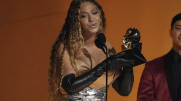 Beyonce holding a Grammy award.