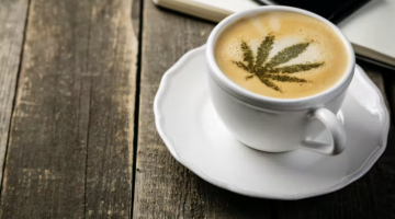 Coffee with a cannabis leaf on it.