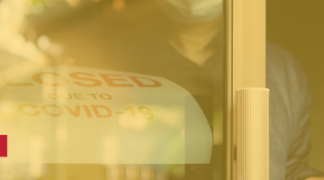 COVID-19 closed sign with someone closing the door. Overlay of yellow and the Lang logo.