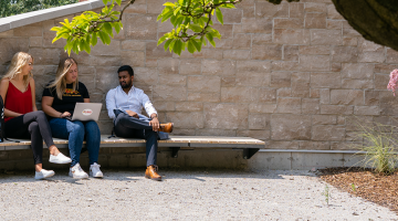 students outside on campus talking