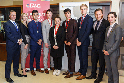 Judges posing with students and their medals