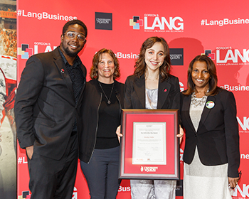 Photo of Bailey receiving her scholarship award