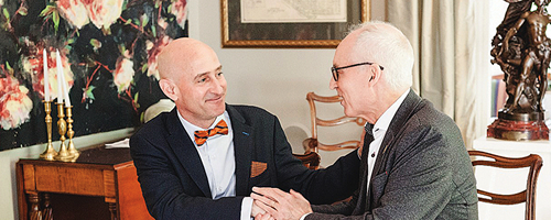 president vacarino shaking hands with donor