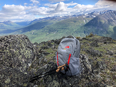 Yukon logo on backpack in mountains