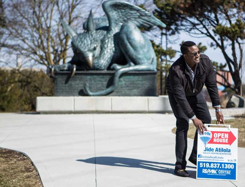 Jide Atilola standing in front of a Gryphon