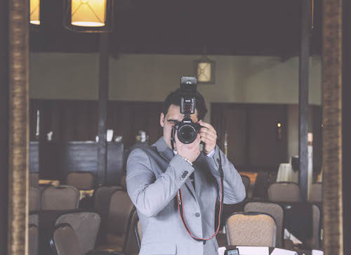Teodor takes a photo at an event