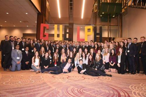 DECA U Guelph delegation poses at the Sheraton Centre in business attire