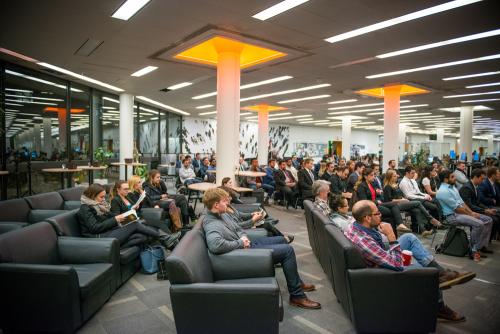 Gryphons' Den audience members watch presentations in the Library