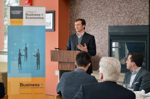 Photo of Simon Whitfield speaking at honorary doctorate luncheon