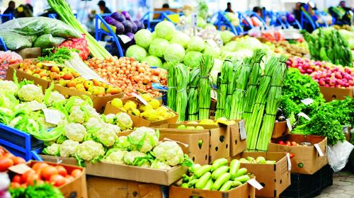 A colourful variety of vegetables on display at an outdoor market