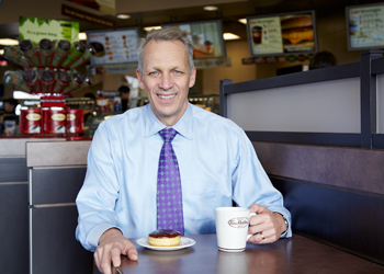 Roland Walton, notable alumni, at a Tim Horton's table