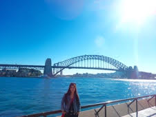Katie Lo posing by the ocean in Australia