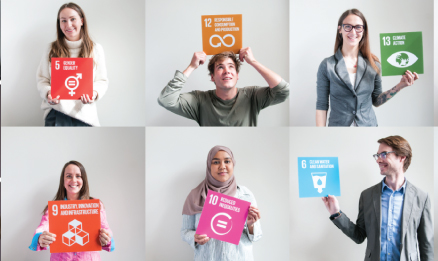 students holding SDG goals