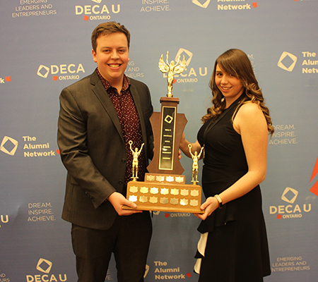 U of G student delegates with trophy