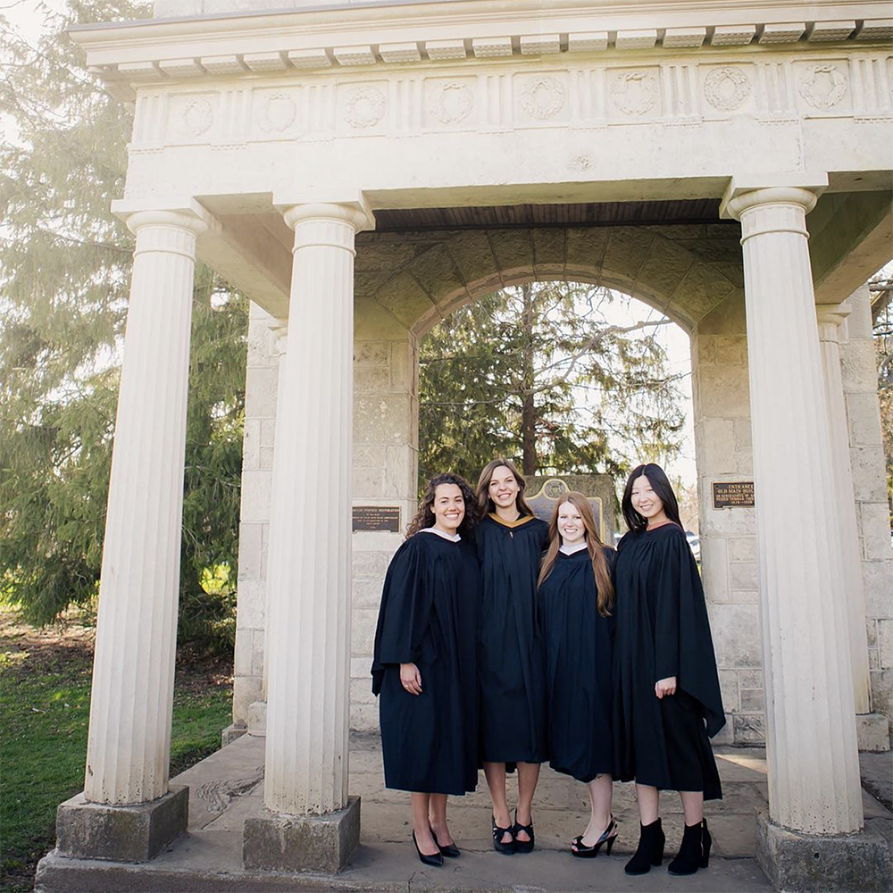 Guelph Grads posing in front of The Portico