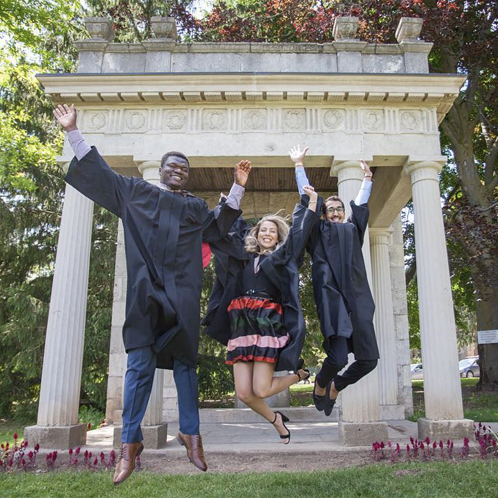 Guelph Grads posing in front of The Portico