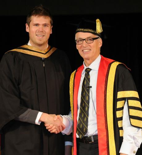 Justin McManus receiving his MSc. Degree from University of Guelph President