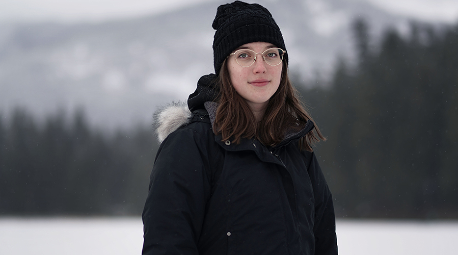 Catrina outside in parka in the winter