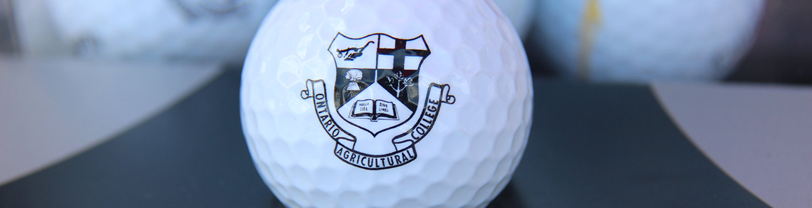 A golf ball with the OAC crest on it.