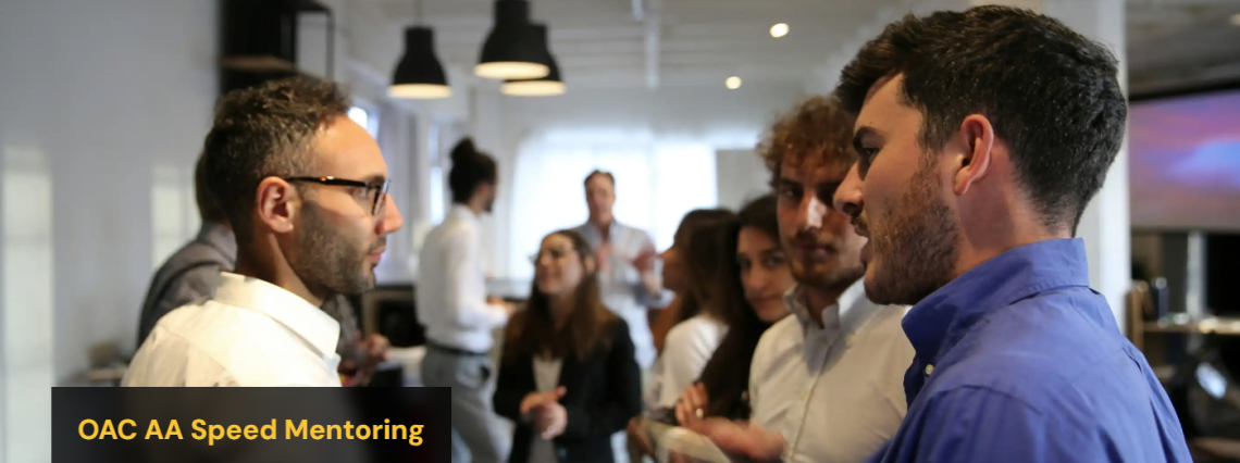 three people talking at a networking night on campus
