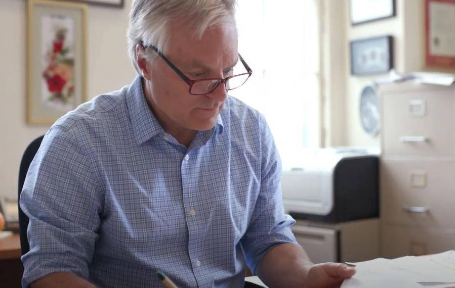 Alfons working at his desk.