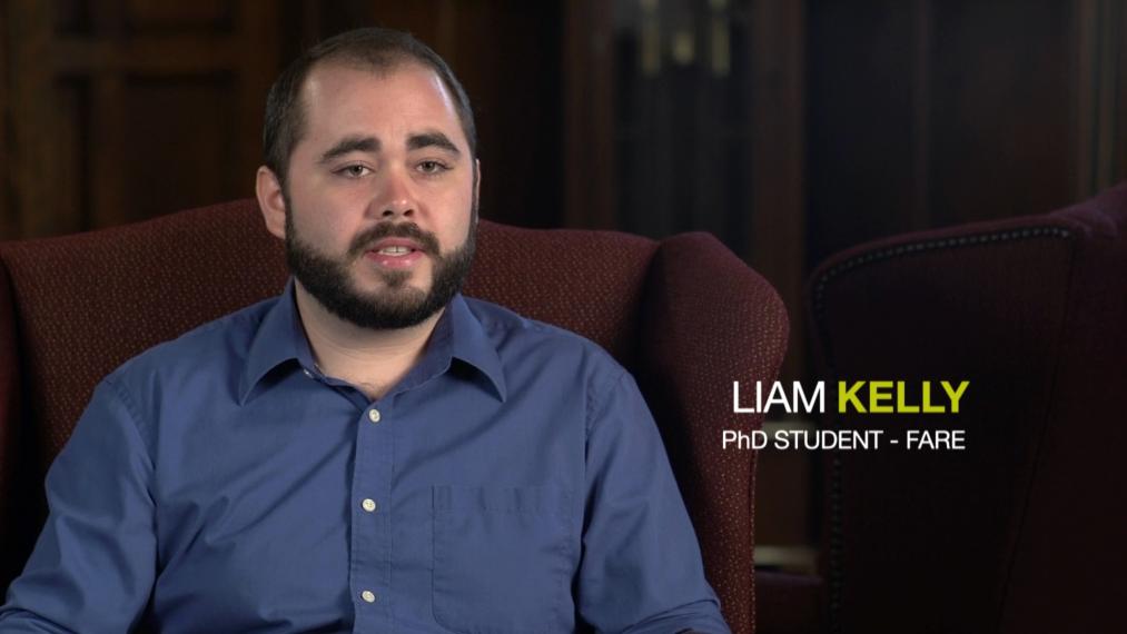 Liam Kelly sitting in arm chair with text overlay saying Liam Kelly PhD FARE student