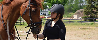 Julia with a horse.