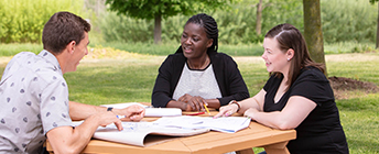 Three students working on a project.