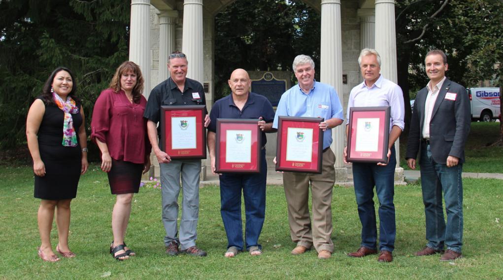 Group photo of faculty award winners and presenters outside in front of Portico