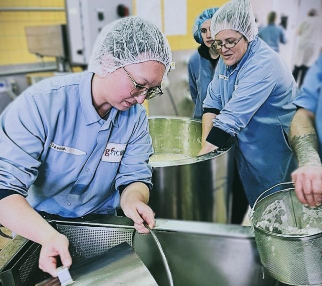 Students participating in cheese making 