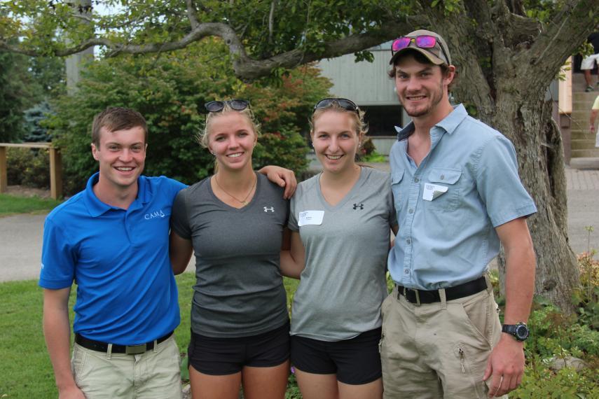 a photo of oac alumni outside smiling for camera