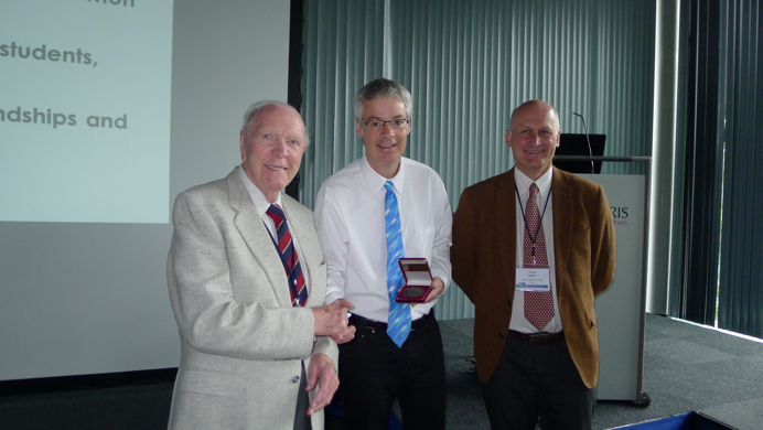 Doug stands with Prof. Gly Phillips and Dr. Graham Sworn as he recieves his award
