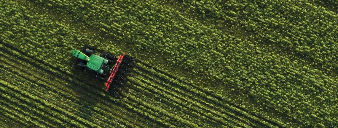 An overhead photo of a tractor in a field 