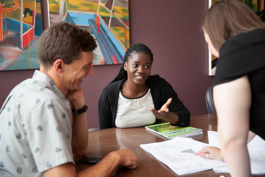 students in the rural planning masters program are discussing a project in a classroom