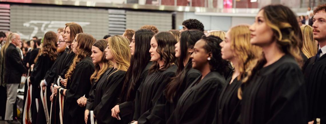 students standing at convocation