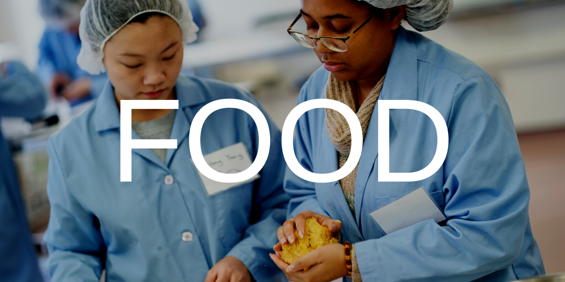 Two students in a food science lab, with the text Food overlaid.