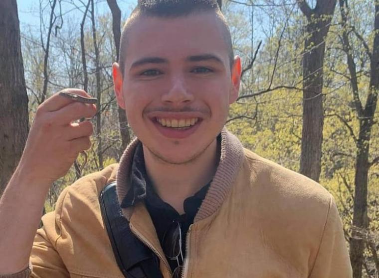 Headshot of Brad smiling in a forest